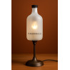 Offrez une lampe personnalisable en verre givré avec base en métal bronze. Un éclairage chaleureux et perssonalisable.